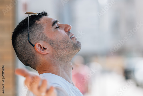 man breathing relaxed outdoors in summer
