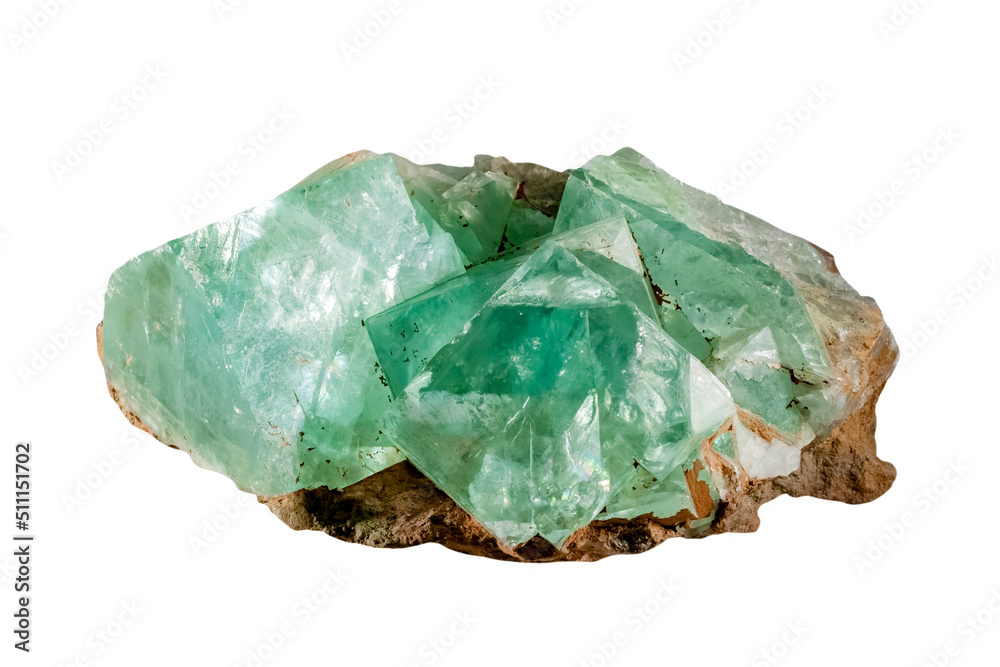 Macro close-up of a sample of a green-blue rare mineral fluorite on a white background. Transparent greenish blue crystal. Close-up isolated on a white background Macro close-up of a sample of a green-blue rare mineral fluorite on a white background. Transparent greenish blue crystal. Close-up isolated on a white background