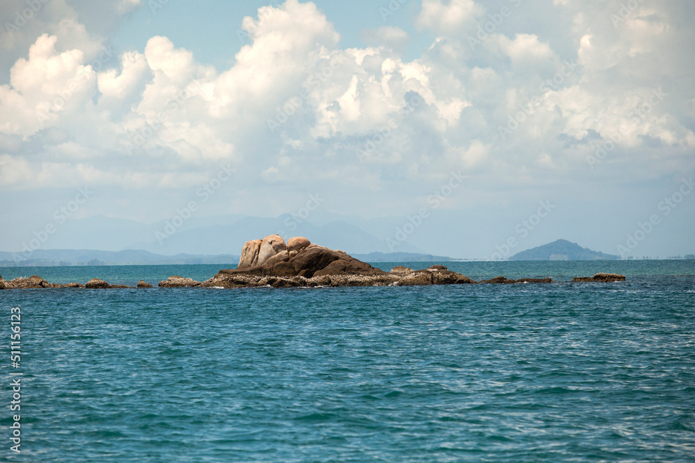 natural rock over blue sea in rayong eastern of thailand