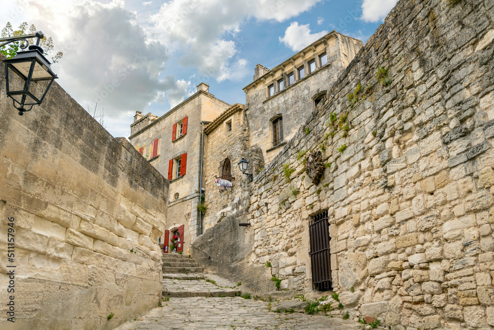 A narrow alley leading to the walled village of Les Baux-de-Provence, France, in the Alpilles Mountains of the Cote d'Azur region of southern France.