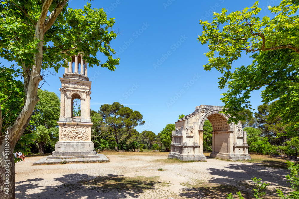 The ancient Roman Mausoleum of the Julii alongside the triumphal arch at the historic Glanum archaeological site near Saint-Remy-de-Provence in the Provence region of Southern France.
