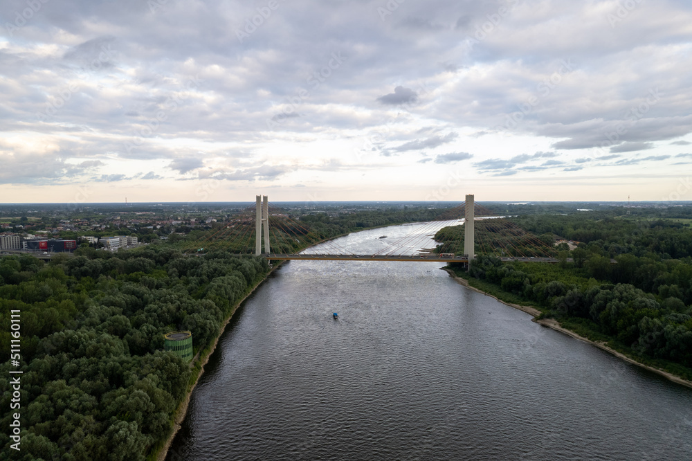large automobile bridge across the the Vistula River. Cloudy rainy day in Warsaw, Poland