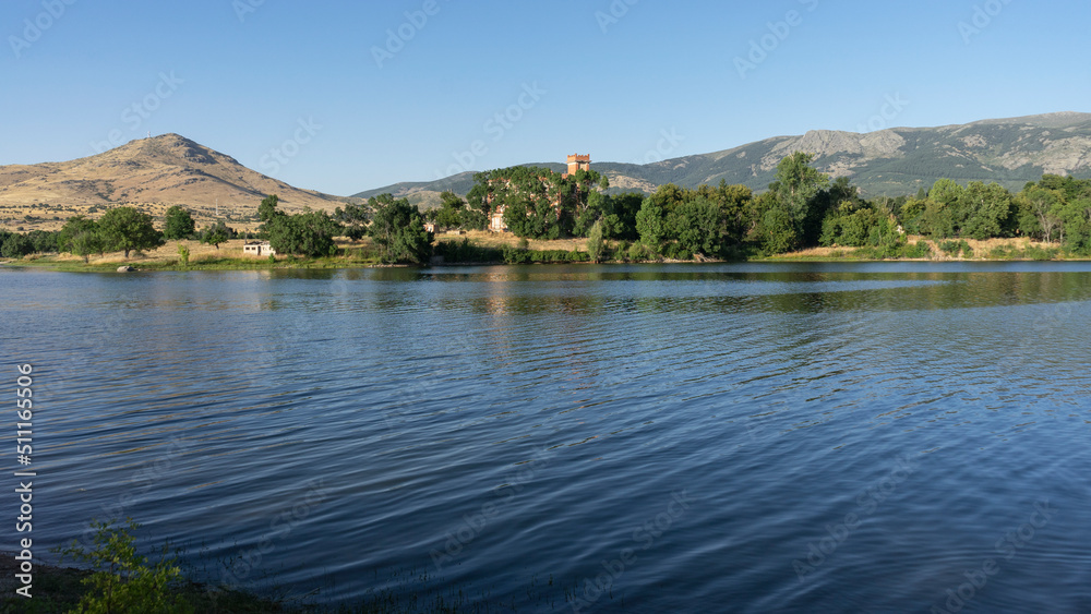 Landscape of the Pontoon reservoir in Segovia on a summer day with clear skies.