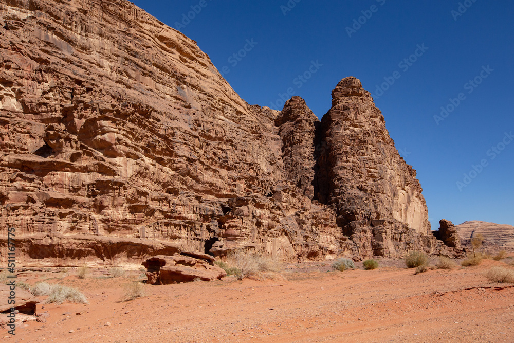 Stone formations in Wadi Rum desert. Sunny day in Wadi Rum, Jordan Stone formations in Wadi Rum desert. Sunny day in Wadi Rum, Jordan