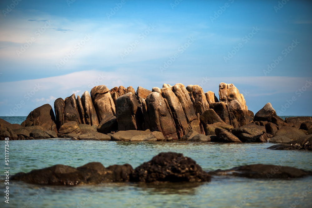 natural rock over blue sea in rayong eastern of thailand