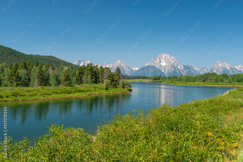 Snake river by Oxbow Bend in summer with Grand Tetons peaks in background, Grand Teton national park, Wyoming, USA.