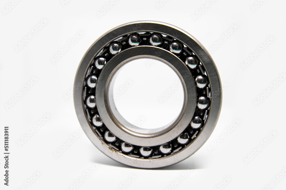 Metal silver ball bearing with balls on white isolated background. Bearing industrial. Part of the car Metal silver ball bearing with balls on white isolated background. Bearing industrial. Part of the car