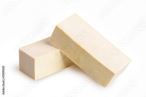 Piece of tofu cheese isolated on white background.