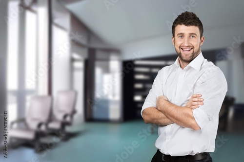 Happy mature male business leader standing at office window. Job success concept © BillionPhotos.com