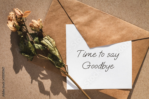 Time to say goodbye note, envelope and dry roses