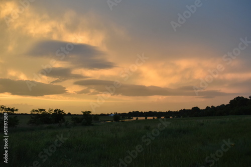 Dramatic Sunset Over a Lake in a Field
