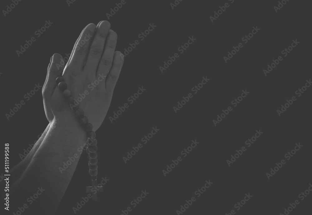Praying hands with faith in religion and belief in God on dark ...