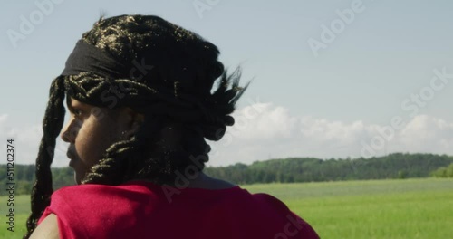 Samson scanning the surrounding landscape, Biblical character with long dreads, Israelite warrior and judge, black male in old testament, Christian photo