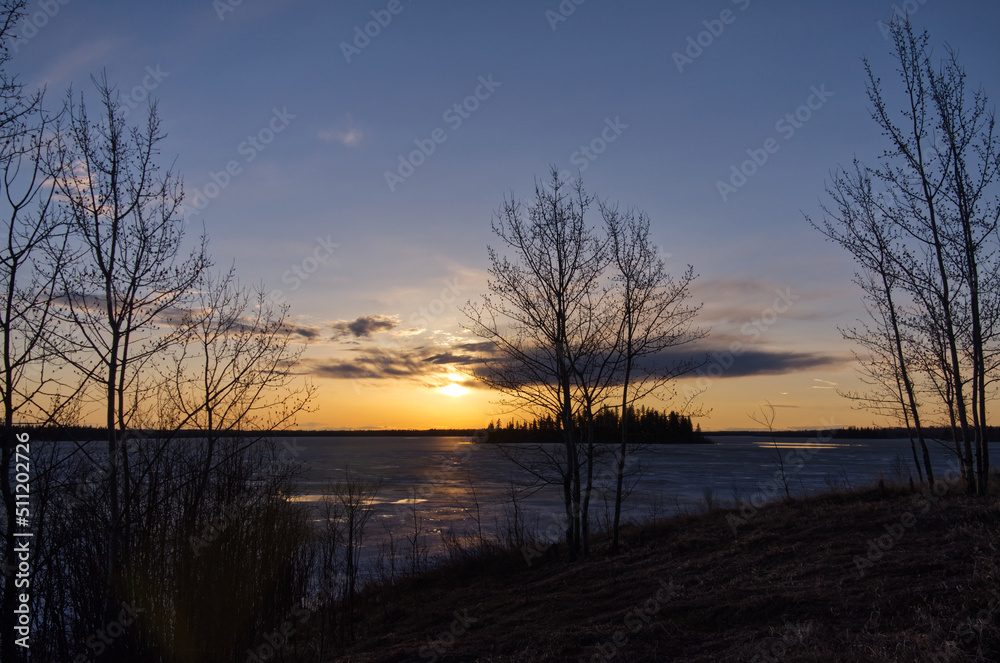 Evening Sunset over a Partially Frozen Lake
