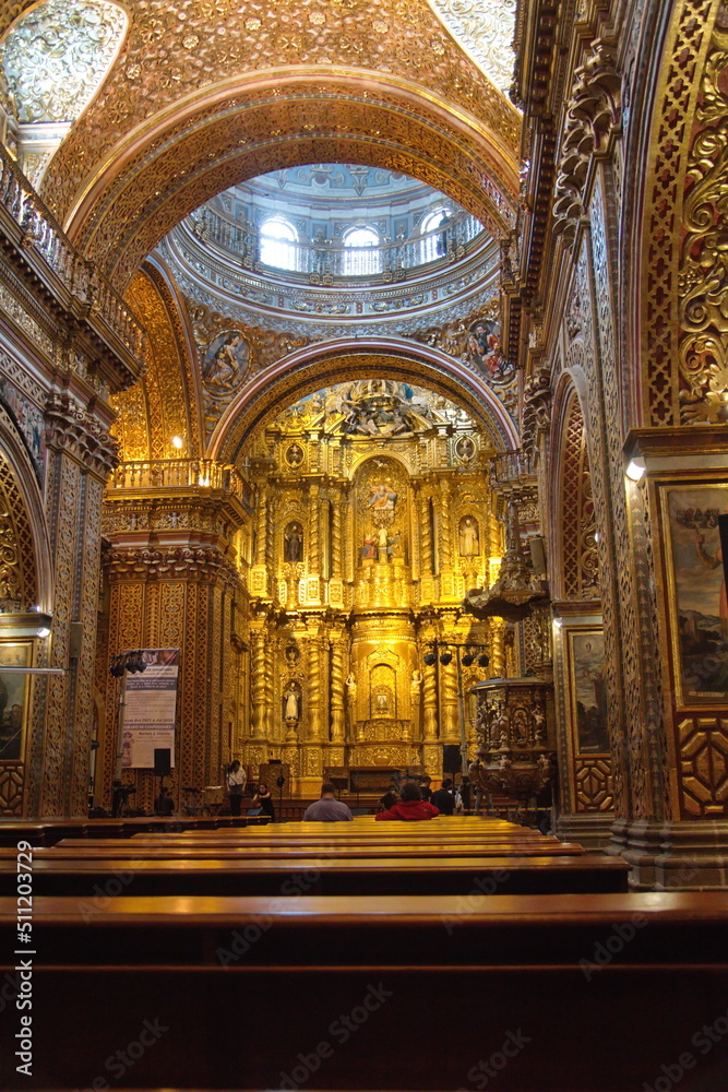 Altar behind an arch in the Church of la Compania de Jesus, or the Gold Church,  in the Old Town Quito, Ecuador