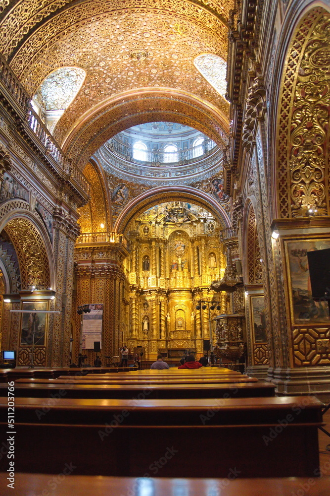 Altar behind an arch in the Church of la Compania de Jesus, or the Gold Church,  in the Old Town Quito, Ecuador