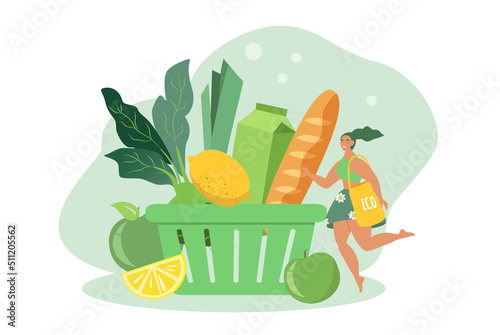 Fototapeta Naklejka Na Ścianę i Meble -  vector illustration in a flat style on the theme of organic wholesome food. food basket and girl with eco bag