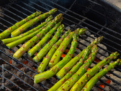 Green asparagus grilling on hot BBQ
