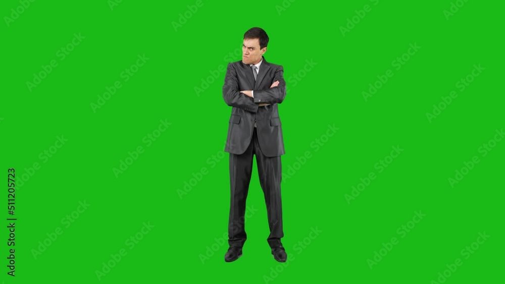Offended businessman with crossed arms in chroma key Offended businessman with crossed arms in chroma key