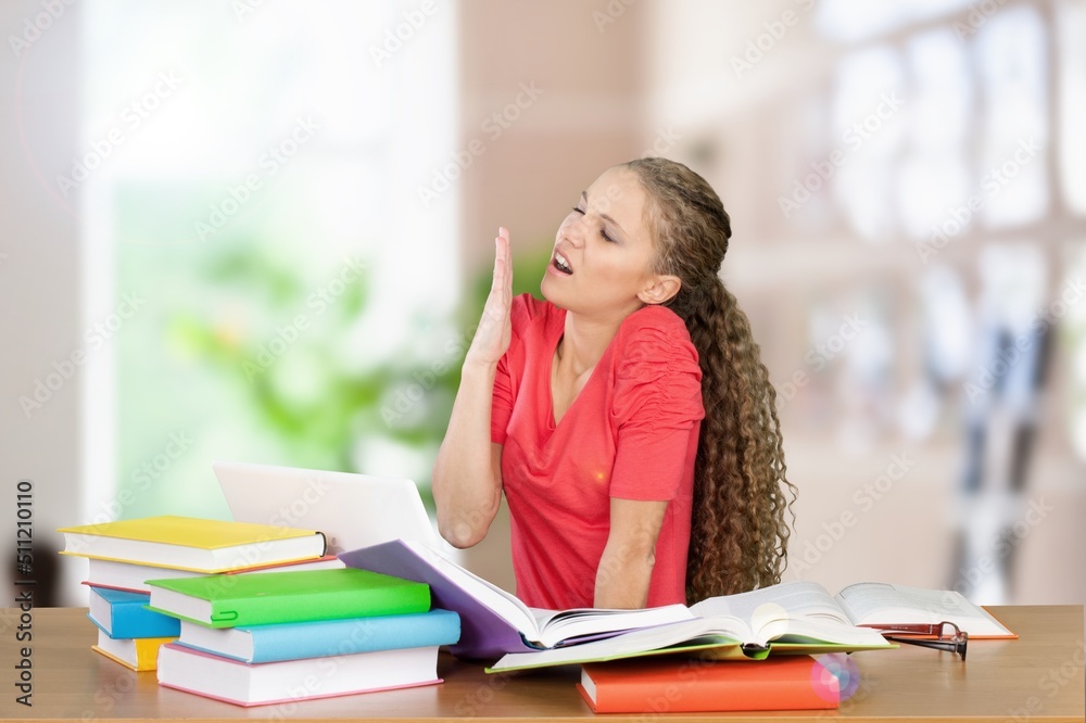 Young women stress from overwork on an office background. Young women stress from overwork on an office background.