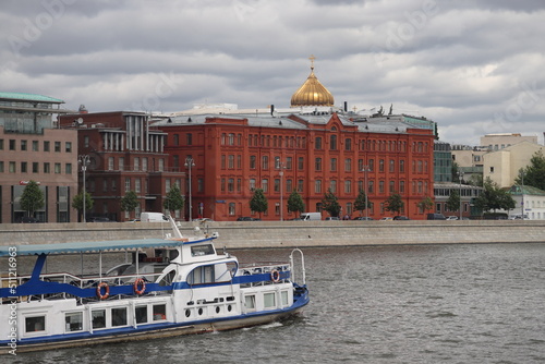 Moscow, Russia - June 2022: River pleasure boat on the Moscow river and Frunzenskaya embankment. photo