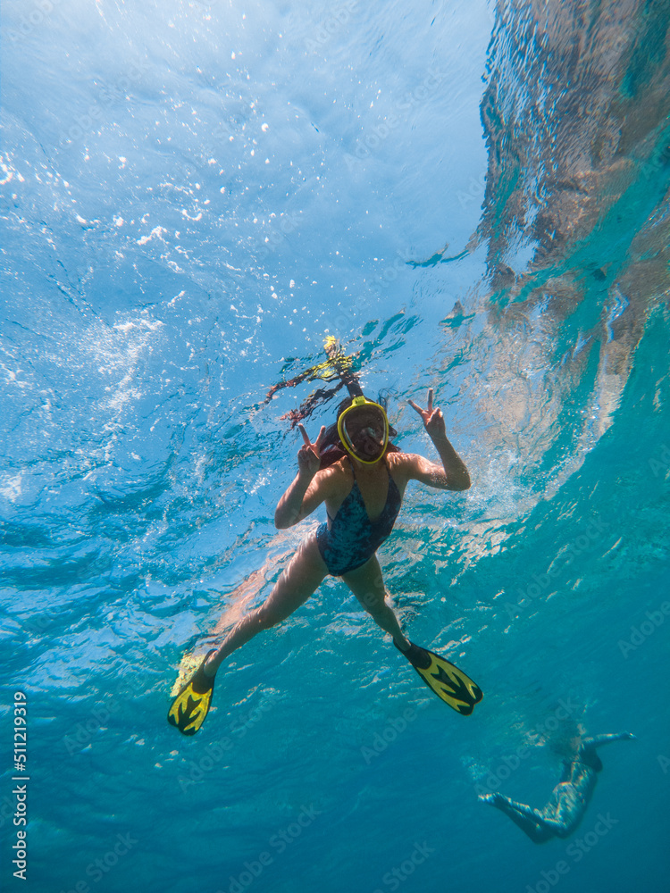 beautiful woman swimming underwater with snorkeling mask and flippers - obrazy, fototapety, plakaty 