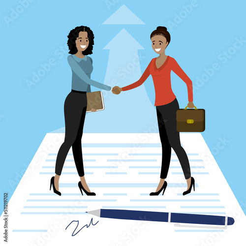 Hispanic women approved good deal. New project development. Female managers shake hands after successful negotiations. Large pen signs paper contract. Agreement, corporation relationship.