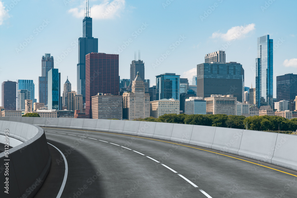 Obraz premium Empty urban asphalt road exterior with city buildings background. New modern highway concrete construction. Concept of way to success. Transportation logistic industry fast delivery. Chicago. USA.