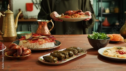 Kabsa, maqluba, dolma, tabbouleh close-up, rice and meat dish, middle eastern national traditional food. Muslim family dinner, Ramadan, iftar. Arabian cuisine. photo