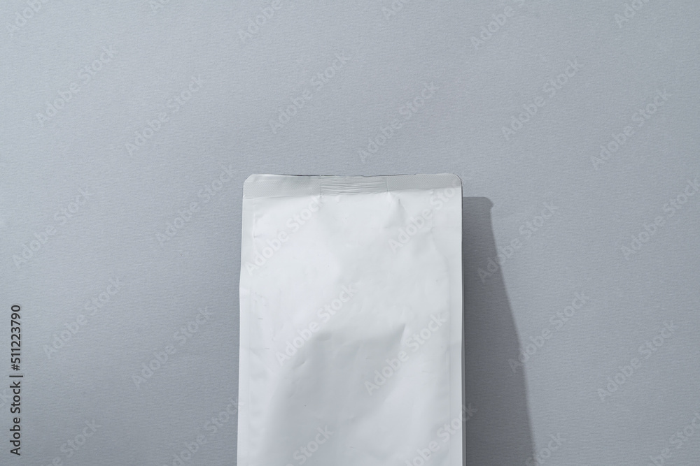 White blank matte coffee package on paper background White blank matte coffee package on paper background