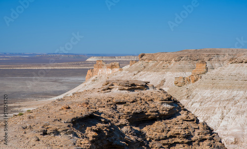 The amazing desert landscape background. Beautiful landscape of desert mountains. Monolithic mountains in desert. Stones and the sky. Bizarre sandstone cliffs in the desert.