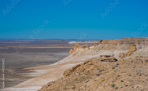 The amazing desert landscape background. Beautiful landscape of desert mountains. Monolithic mountains in desert. Stones and the sky. Bizarre sandstone cliffs in the desert.