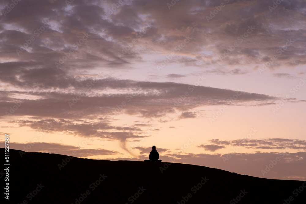 Zen sesshin (retreat) in the Sahara desert, Morocco. Zazen (meditation) at dawn. 25.02.2017