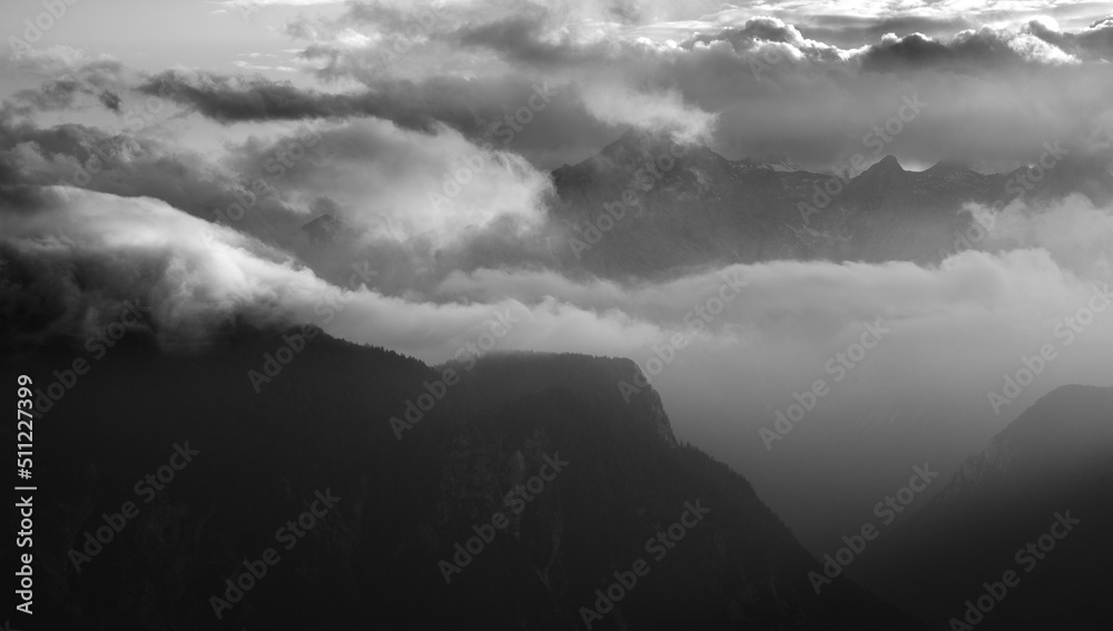 Fototapeta premium Autumn landscape in the mountains on a sunrise with fog. 