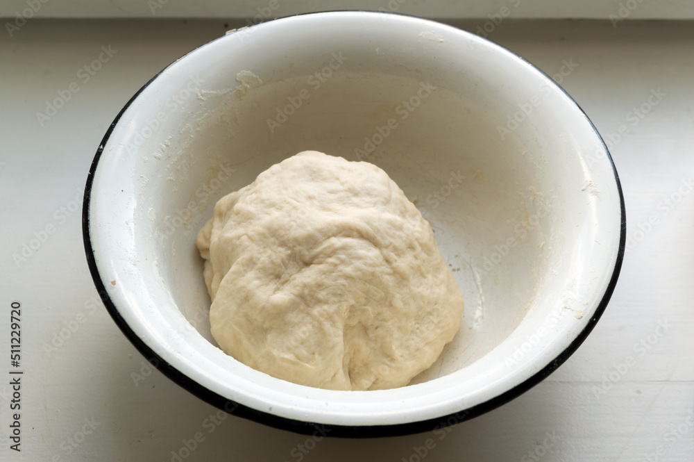 a piece of dough in a bowl a piece of dough in a bowl