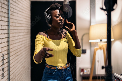 Black Singer Recording in Music Studio