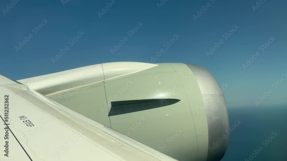 Close up of engine of airplane turning right in the sky on sunny day. Airline, air transportation concepts Close up of engine of airplane turning right in the sky on sunny day. Airline, air transportation concepts