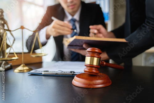 Lawyer or judge discussing legal matters in a client's trial at a lawyer's office, litigation consultation ideas with lawyers.