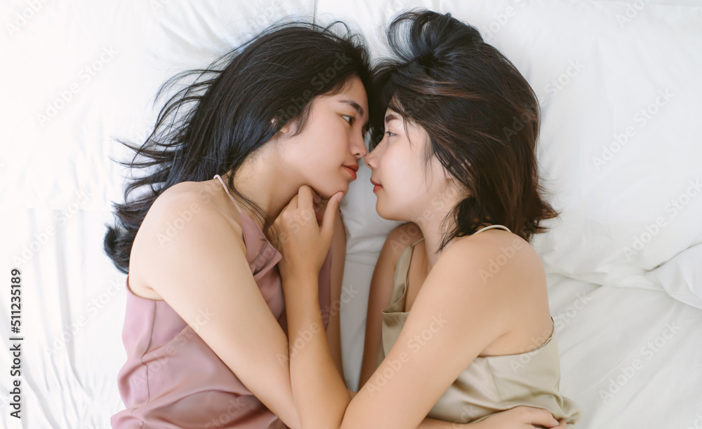 Top View Of Beautiful LGBT Lesbian Asian Couple In Love Two Young Top View Of Beautiful LGBT Lesbian Asian Couple In Love Two Young
