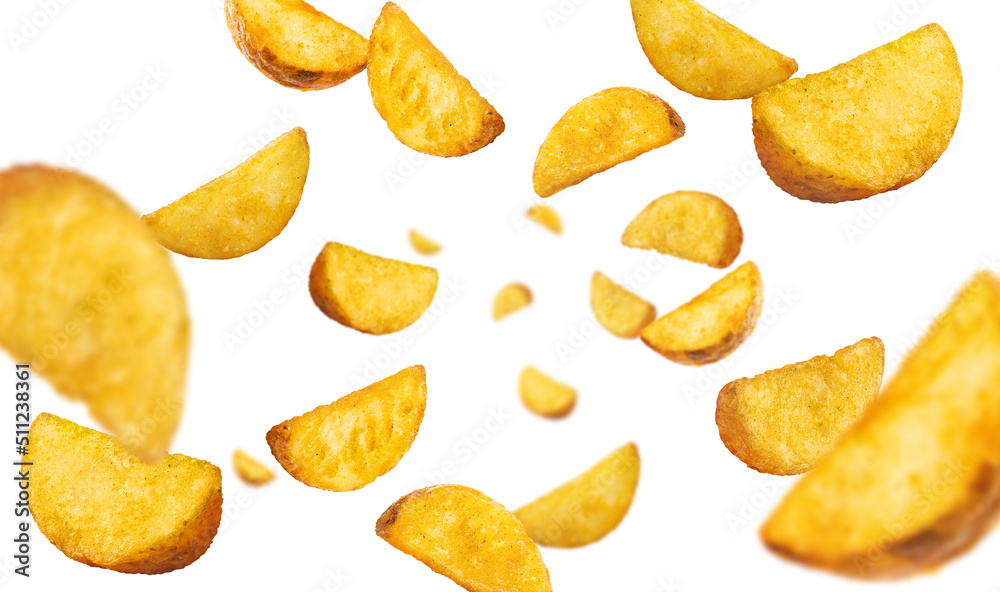 Flying fried potato wedges, isolated on white background Flying fried potato wedges, isolated on white background