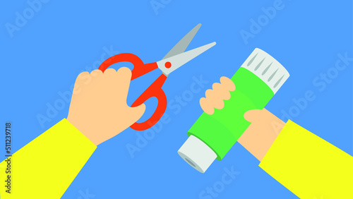The child holds scissors and a spool of thread in his hands