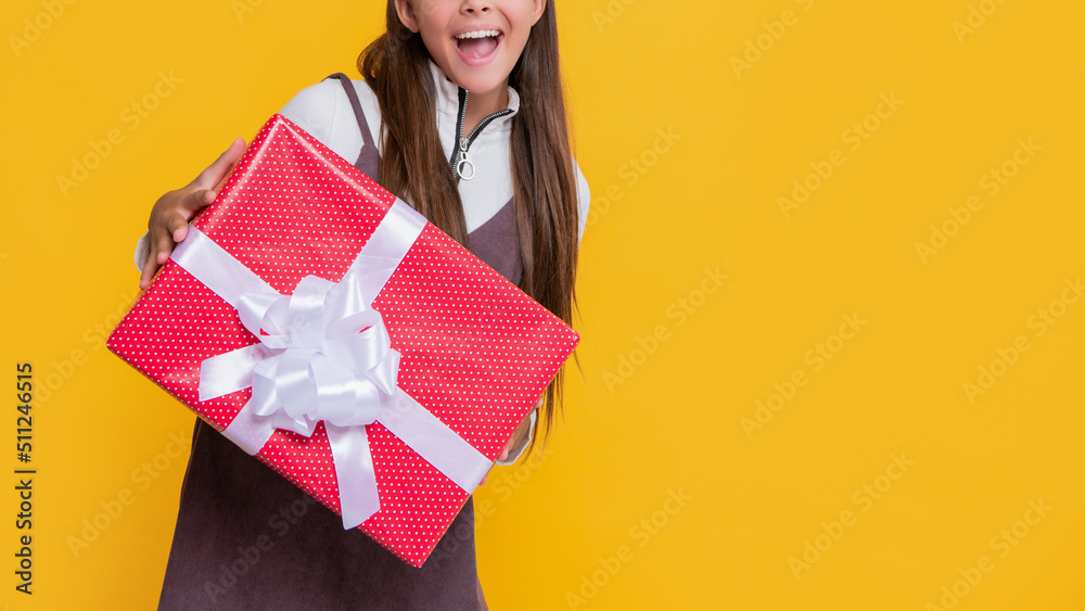 kid with present box on yellow background. wow kid with present box on yellow background. wow