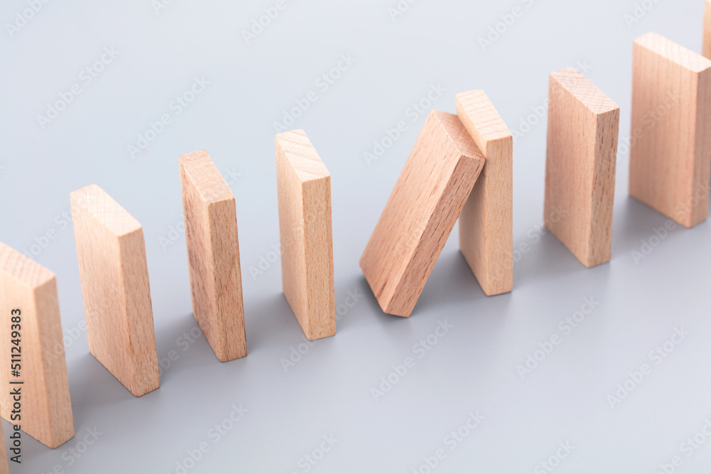 Dominoes about to collapse on background Dominoes about to collapse on background