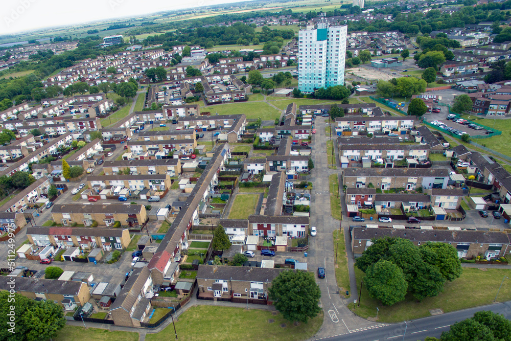 Arial view of suburban residential tower block with flammable cladding