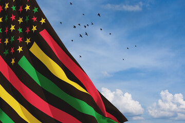 Alternative Juneteenth Flag with flying birds in blue cloudy sky. Since 1865. Design of Banner with place for text. 3d-rendering.
