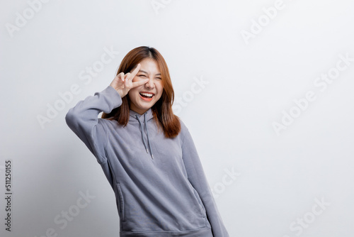 Beautiful Asian woman gesturing for advertisement editing on isolated background, portrait concept used for advertisement and signage, isolated over white background, copy space.