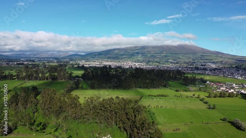 Corazon volcano belongs to the Andes mountain range. 4K videos. aerial drone view showing Volcano Corazon from a field in machachi, Ecuador