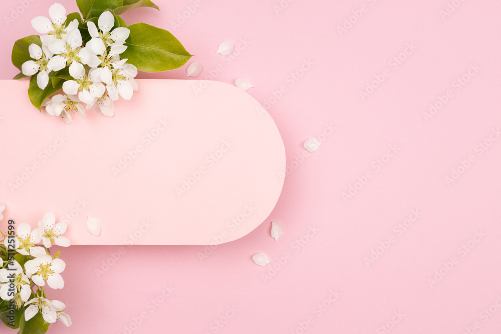 Spring pink blank rounded horizontal pad for text mockup with gentle white apple tree flowers, green leaf on pastel pink. Beautiful floral background for advertising, branding identity, greeting card.