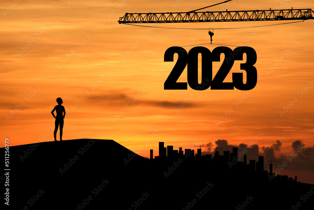 Concept Happy new year Silhouette of engineer and construction to create lifting crane 2023 on sunset background. Concept Happy new year Silhouette of engineer and construction to create lifting crane 2023 on sunset background.