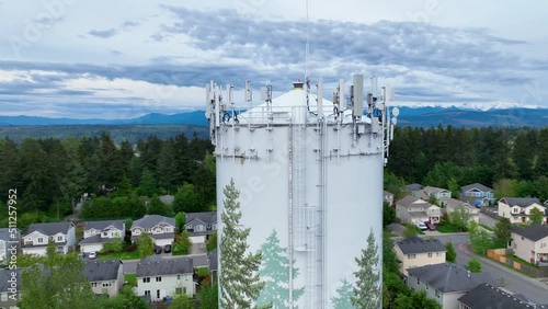 Tight aerial shot of the cell phone tower equipment on top of a water tower. photo